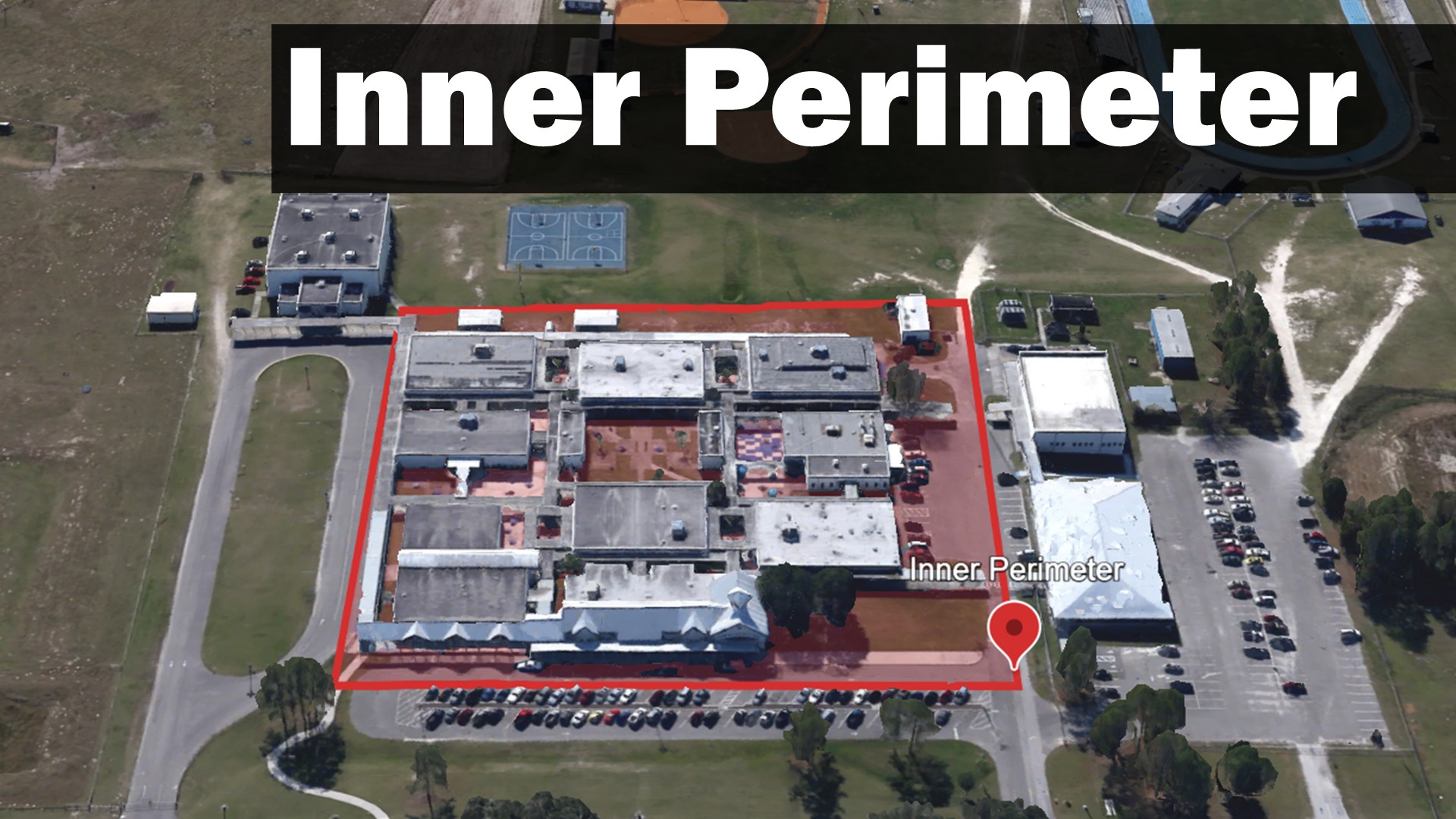 A school campus with a red semi-transparent overlay illustrating an area