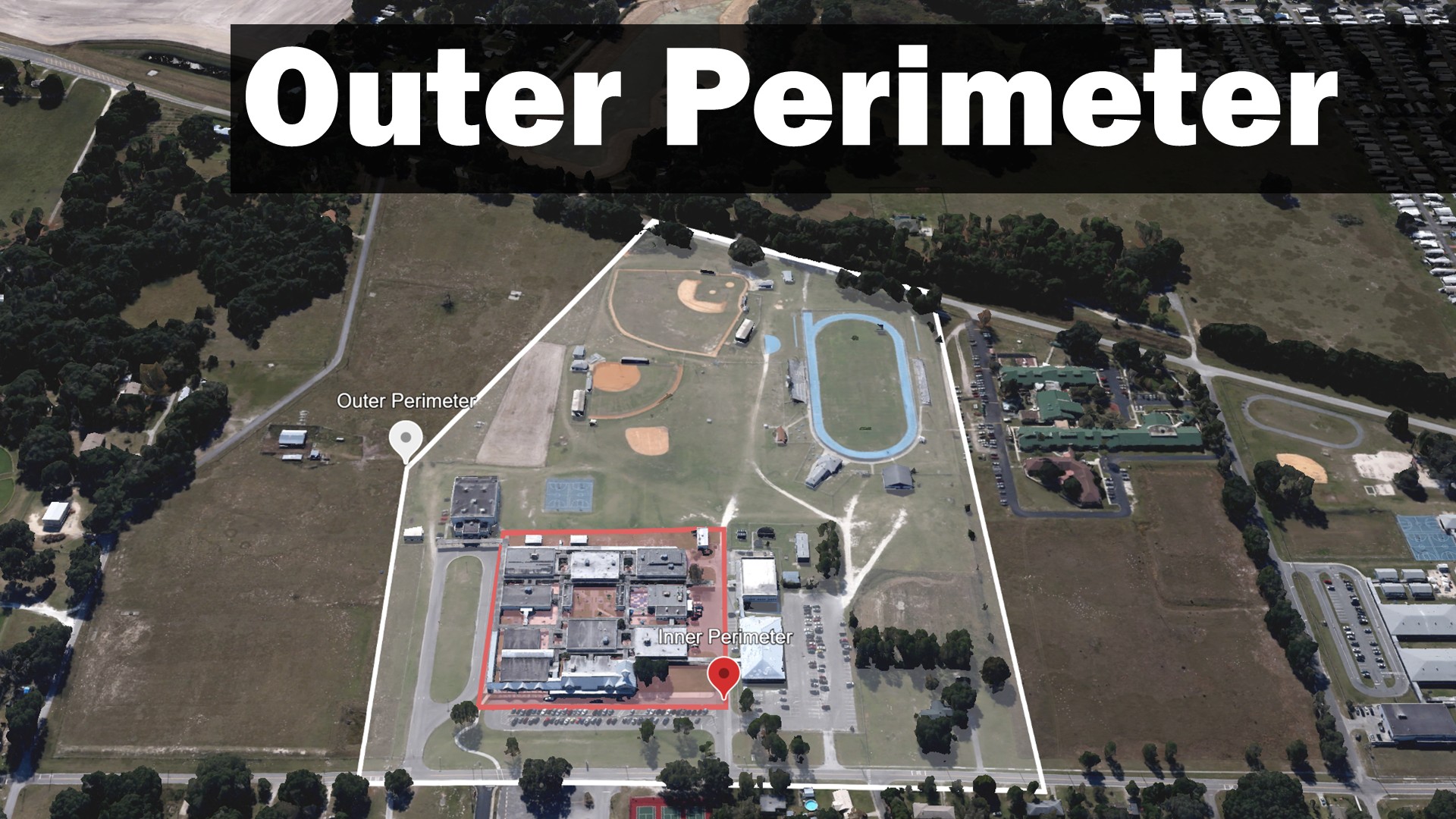 A school campus with a white semi-transparent overlay illustrating an outer perimter